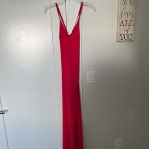Form fitting red dress with slit